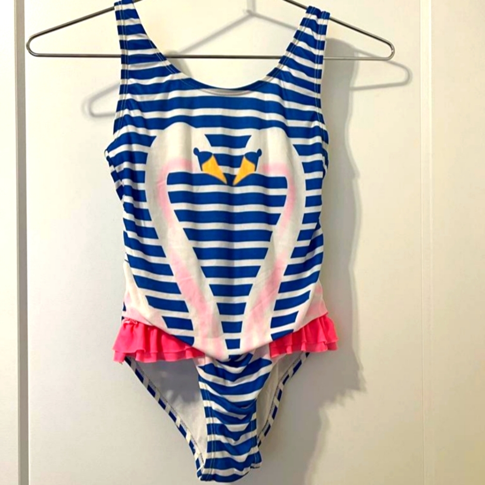 An adorable girls swan bathing suit